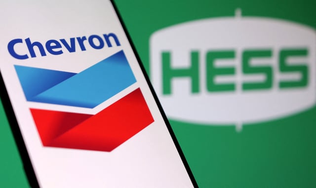 Chevron and Hess logos are seen in this illustration taken, October 23, 2023. REUTERS/Dado Ruvic/Illustration/File Photo