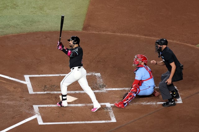 PHOENIX, ARIZONA - JULY 19: Eugenio Suárez #28 of the Arizona Diamondbacks hits a two-run home run during the first inning against the St. Louis Cardinals at Chase Field on July 19, 2025 in Phoenix, Arizona.
