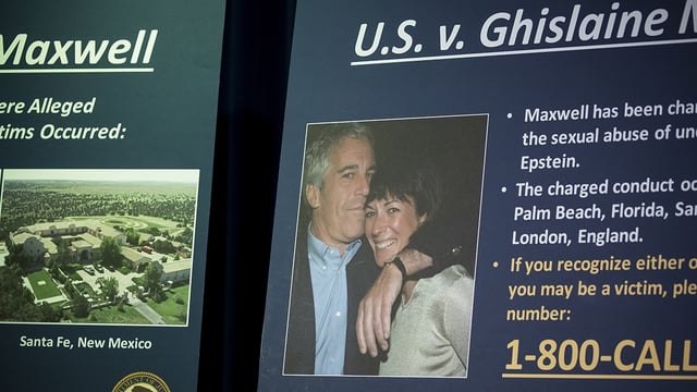 A photograph of Ghislaine Maxwell and Jeffrey Epstein is displayed during a news conference at the U.S. Attorney’s Office in New York, July 2, 2020.  