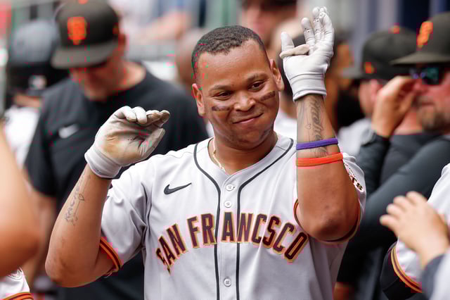 Rafael Devers of the San Francisco Giants reacts after hitting a home run during the fifth inning against the Atlanta Braves at Truist Park in Atlanta on July 23, 2025.