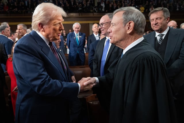 U.S. President Donald Trump (L) greets Chief Justice of the United States John G. Roberts, Jr as he arrives to deliver an address to a joint session of Congress at the U.S. Capitol on March 04, 2025, in Washington, DC.