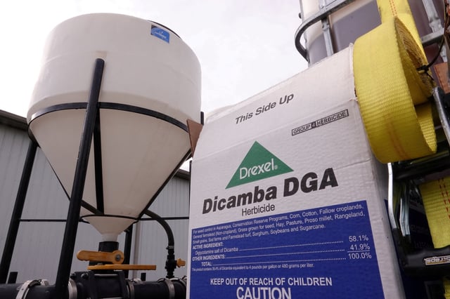 A box of Drexel herbicide Dicamba DGA lies on a truck bed at a farm in Ridgely, Tennessee, U.S. May 1, 2019. Picture taken May 1, 2019.  REUTERS/Karen Pulfer Focht/File Photo