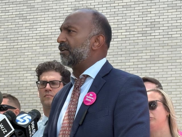 Attorney Thiru Vignarajah, who is representing families of students involved in Matthew Schlegel’s case, speaks during a news conference outside Anne Arundel County Public Schools’ Dr. Carol Sheffey Parham Building in Annapolis on July 23. (Maggie Trovato/Staff)