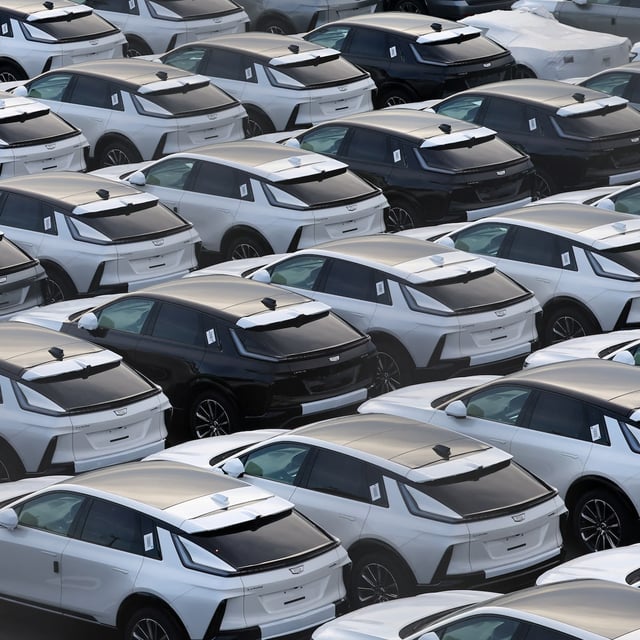 U.S. automaker General Motors' Cadillac vehicles are lined up at a vehicle storage yard at an industrial port near Tokyo on Wednesday.