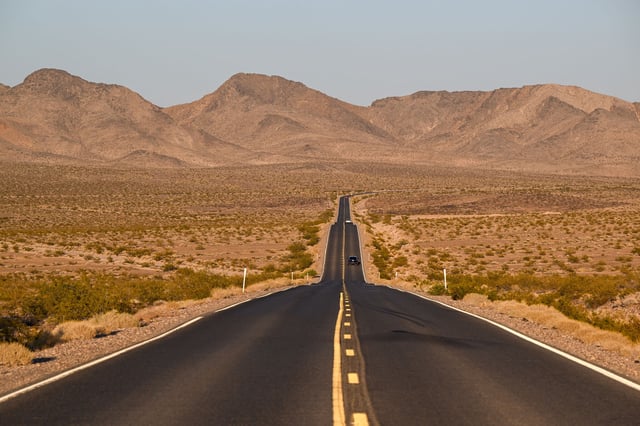FILE: A road appears during sunset in Death Valley, Calif. A missing woman, whose vehicle was discovered just outside the park earlier this year, was recently found alive.