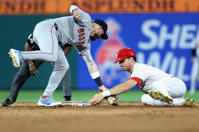 Max Kepler #17 of the Philadelphia Phillies steals second base against Trevor Story #10 of the Boston Red Sox in the sixth inning during a game at Citizens Bank Park on July 22, 2025 in Philadelphia, Pennsylvania.