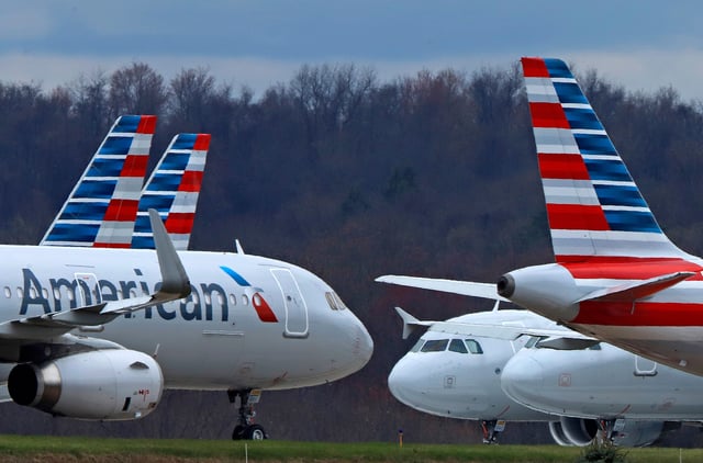 FILE - American Airlines planes are parked at Pittsburgh International Airport on March 31, 2020, in Imperial, Pa. (AP Photo/Gene J. Puskar, File)
