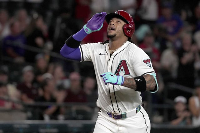 Arizona Diamondbacks&#39; Ketel Marte reacts after hitting a solo home run in the first inning of a baseball game against the Houston Astros, Wednesday, July 23, 2025, in Phoenix. (AP Photo/Rick Scuteri)