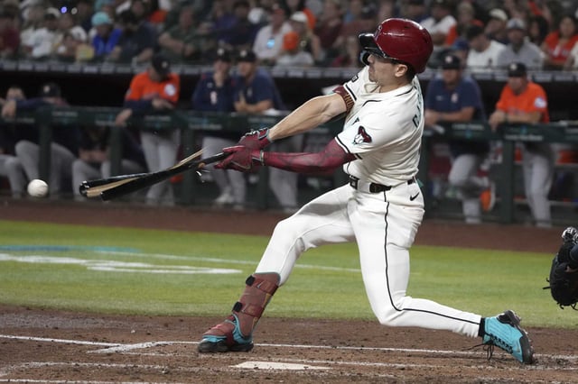 Arizona Diamondbacks&#39; Corbin Carroll breaks his bat in the fifth inning during a baseball game against the Houston Astros, Wednesday, July 23, 2025, in Phoenix. (AP Photo/Rick Scuteri)