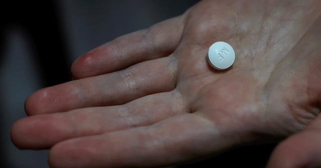 A patient prepares to take Mifepristone, the first pill in a medical abortion, at Alamo Women's Clinic in Carbondale, Illinois, on April 9, 2024.