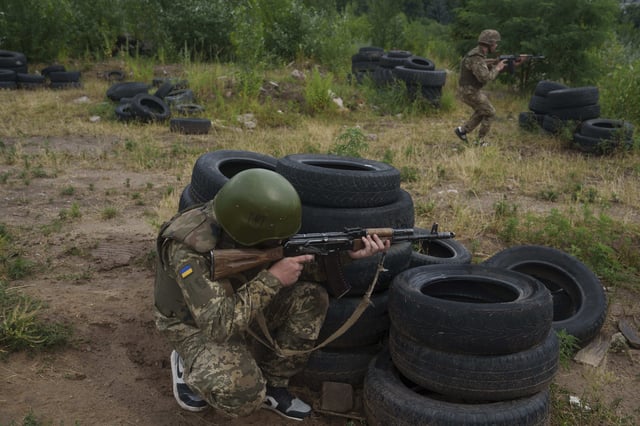 Ukrainian military recruits train at the polygon in the Kyiv region, Ukraine, Wednesday, July 16, 2025. (AP Photo/Evgeniy Maloletka)