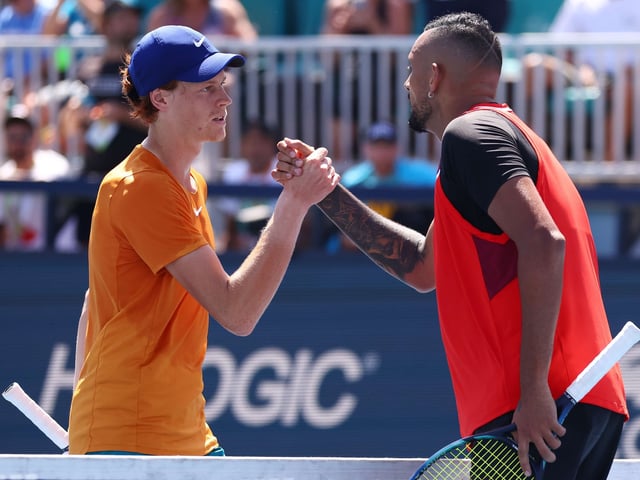 MIAMI GARDENS, FLORIDA - MARCH 29: Jannik Sinner of Italy shakes hands with Nick Kyrgios of Australia after defeating him in their match during the Miami Open at Hard Rock Stadium on March 29, 2022 in Miami Gardens, Florida.   Michael Reaves/Getty Images/AFP
== FOR NEWSPAPERS, INTERNET, TELCOS & TELEVISION USE ONLY ==