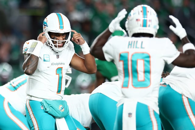 Tua Tagovailoa #1 calls a play to Tyreek Hill #10 of the Miami Dolphins during the first quarter of a game against the Philadelphia Eagles at Lincoln Financial Field on October 22, 2023 in Philadelphia, Pennsylvania.