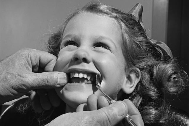 A little girl at the dentist c. 1950.  