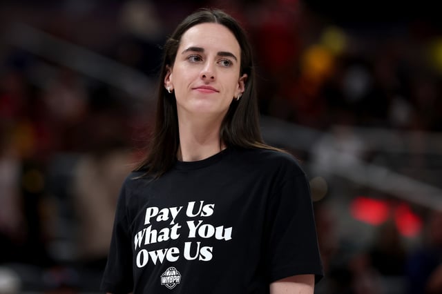 Caitlin Clark #22 of the Indiana Fever wears a shirt saying &#34;Pay us what you owe us&#34; prior to the 2025 AT&amp;T WNBA All-Star Game at Gainbridge Fieldhouse on July 19, 2025 in Indianapolis, Indiana.
