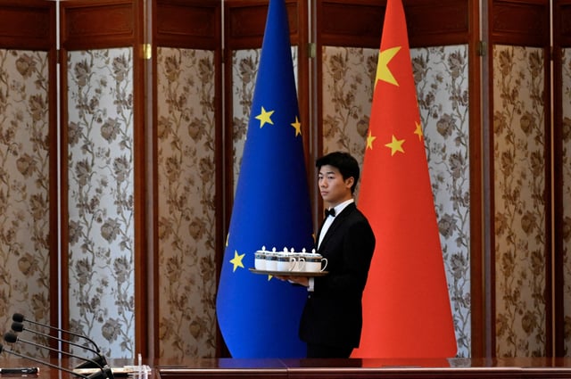 A staff member prepares for the arrival of Chinese Vice Premier Ding Xuexiang and EU Executive Vice-President for Clean, Just and Competitive Transition, Teresa Ribera during China-EU Sixth High-Level Environment and Climate Dialogue (HECD) at the Diaoyutai State Guest House in Beijing on July 14, 2025. Wang Zhao/Pool via REUTERS/File Photo