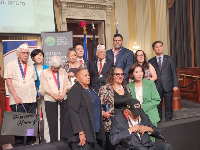 Korean War veterans, their families and Korean lawmakers pose for a photo during the National Korean War Veterans Armistice Day commemoration event at the U.S. Capitol in Washington, D.C., on July 23, 2025. (Yonhap)