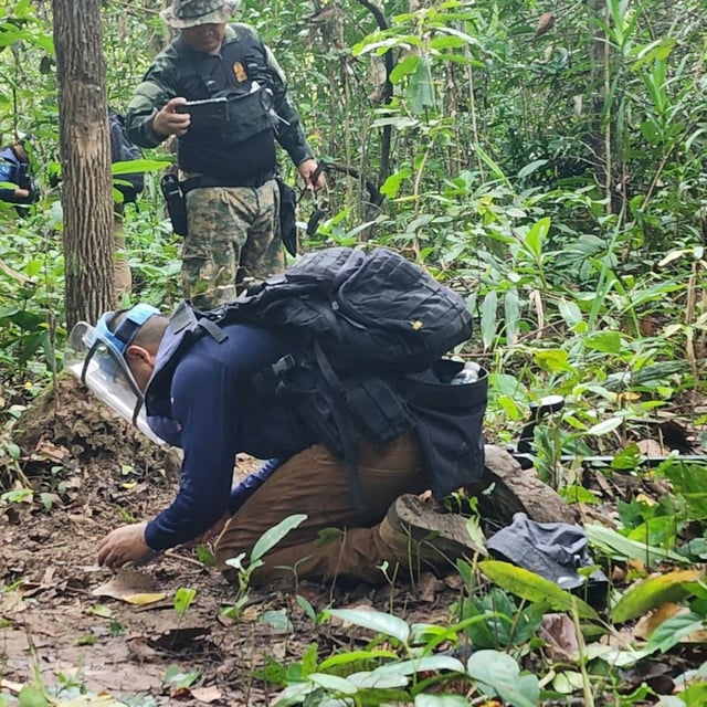 In this Sunday, July, 2025, photo released by the Royal Thai Army, Thai soldiers inspect a border area in Ubon Ratchathani†province where the Royal Thai Army said two anti-personnel landmines were found. (Royal Thai Army via AP)