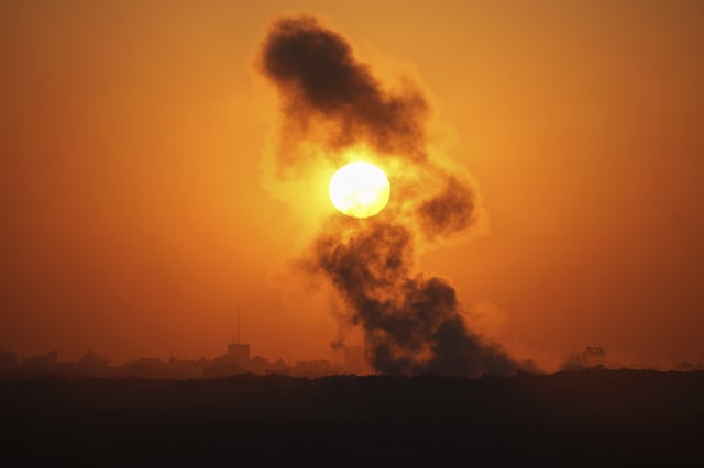 Smoke billows from an explosion in the northern Gaza Strip, as seen from southern Israel Wednesday, July 23, 2025. (AP Photo/Ohad Zwigenberg)
