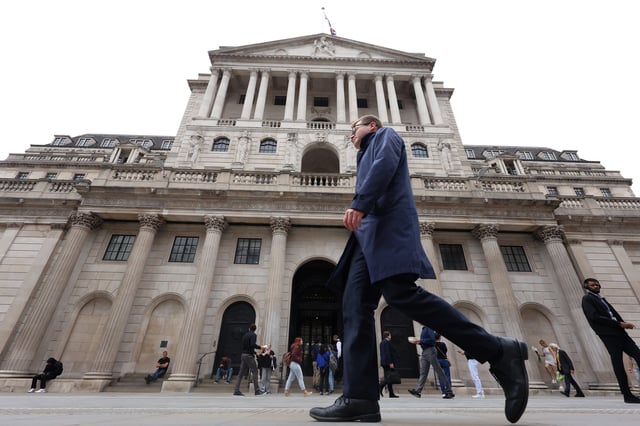 A person walks past the Bank of England, in London, Britain, September 23, 2024. REUTERS/Mina Kim/File photo