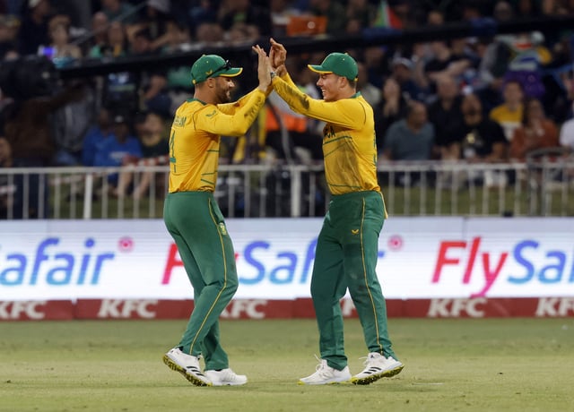 Cricket - First T20 - South Africa vs Australia - Kingsmead Cricket Ground, Durban, South Africa - August 30, 2023 South Africa's Aiden Markram and Dewald Brevis celebrates after taking the wicket of Australia's Aaron Hardie REUTERS/Rogan Ward/File Photo