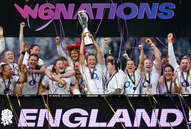 Rugby Union - Women's Six Nations - England v France - Allianz Stadium, Twickenham, London, Britain - April 26, 2025 England's Zoe Aldcroft lifts the trophy as she celebrates with her team mates on the podium Action Images via Reuters/Peter Cziborra/File Photo