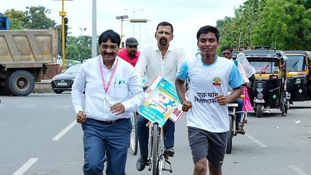 A Class 11 student from a shelter home for underprivileged children runs to his college to mark his first day at junior college, in Latur, Maharashtra, (PTI Photo)