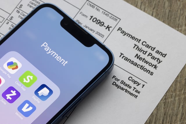 Payment apps like PayPal and Venmo are seen on an iPhone on top of Form 1099-k, Portland, OR, Jan 5, 2022: