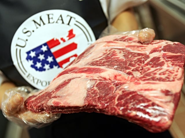 SEOUL, SOUTH KOREA - JULY 13: An employee prepares imported U.S. beef at a store on July 13, 2007 in Seoul, South Korea. South Korean outlets will put U.S. beef on its shelves for the first time in more than three years, selling it for half the price of domestic beef. This marks the first time that a South Korean a supermarket chain has sold a large volume of U.S. beef since the country accepted in April the first shipment of the meat for sale since 2003, when it imposed a ban due to mad cow disease fears. (Photo by Chung Sung-Jun/Getty Images)
