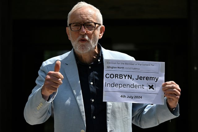 Britain's former Labour Party leader Jeremy Corbyn poses outside Islington Town Hall in London on June 5, 2024 after submitting his nomination papers to officially stand as an Independent candidate in Islington North for the July 4 general election.