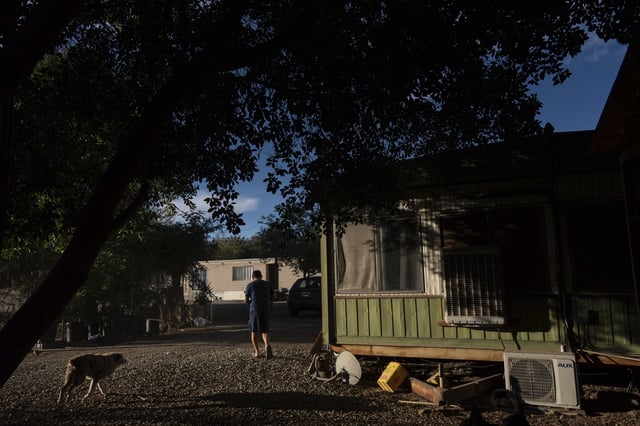 Virgilio Galarza Rodriguez works outside his mobile home in Oasis, Calif., Wednesday, Oct. 30, 2024. (AP Photo/Jae C. Hong)