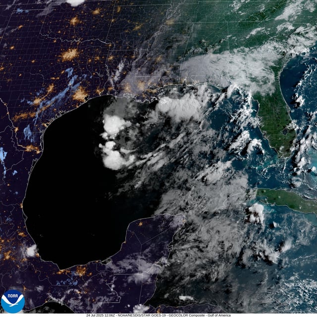 In this weather satellite photo taken Thursday morning, a tropical disturbance is seen moving westward as the sun rises. This tropical disturbance has low development odds before it reaches the western Gulf Coast Friday into Saturday.