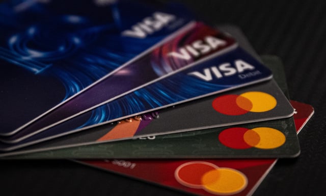 The move comes amid pressure from payment processors such as Visa and Mastercard. (Getty)