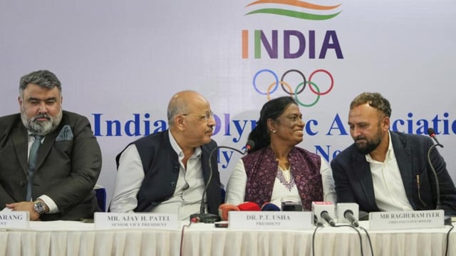 Indian Olympic Association President P.T. Usha, second right, talks with Chief Executive Officer Raghuram Iyer during a joint press conference in New Delhi. (AP)