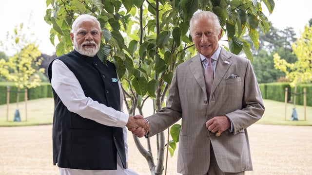 PM Narendra Modi meets King Charles at Sandringham House during UK visit.

