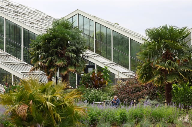 The Princess of Wales Conservatory is seen from the new Carbon Garden, a permanent installation highlighting the role of plants and fungi in tackling climate change, at Kew Gardens in London, Britain, July 24, 2025. REUTERS/Isabel Infantes