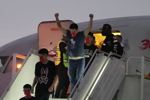 Migrants deported months ago by the United States to El Salvador under the Trump administration's immigration crackdown arrive at Simon Bolívar International Airport in Maiquetia, Venezuela, Friday, July 18, 2025. (AP Photo/Ariana Cubillos)