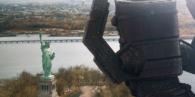 The shadow of Galactus looms large over the Statue of Liberty in a shot from The Fantastic Four: First Steps.