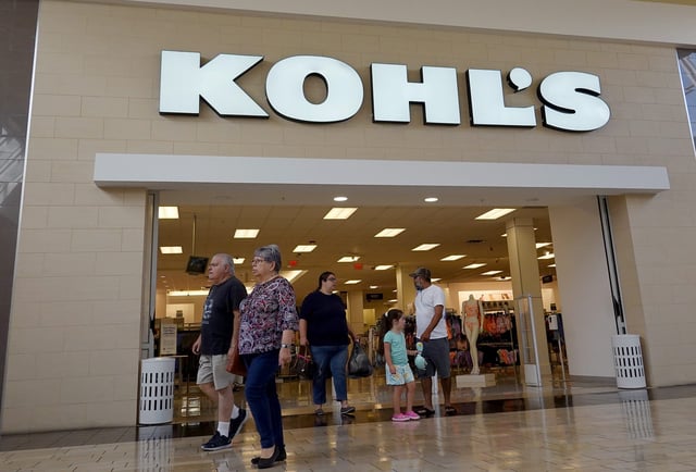 People walk near a Kohl's department store entranceway on June 7, 2022 in Doral, Florida.