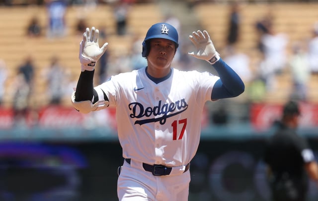 Jul 23, 2025; Los Angeles, California, USA; Los Angeles Dodgers designated hitter Shohei Ohtani (17) celebrates a solo home run during the first inning against the Minnesota Twins at Dodger Stadium. Mandatory Credit: Kiyoshi Mio-Imagn Images