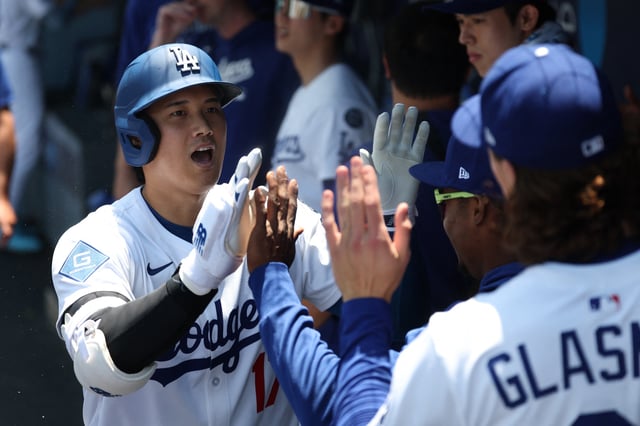 Jul 23, 2025; Los Angeles, California, USA; Los Angeles Dodgers designated hitter Shohei Ohtani (17) celebrates a solo home run during the first inning against the Minnesota Twins at Dodger Stadium. Mandatory Credit: Kiyoshi Mio-Imagn Images