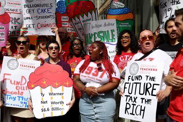 Chicago Teachers Union members and supporters rally outside CPS headquarters on July 24, 2025, before the Board of Education meeting. (Antonio Perez/Chicago Tribune)