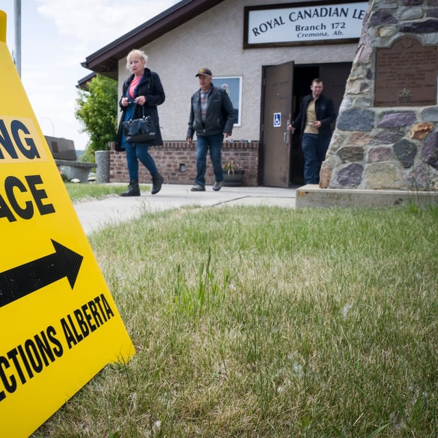 Voters leave a polling station after casting ballots in an Alberta byelection for the Olds-Didsbury-Three Hills riding, in Cremona, Alta., Monday, June 23, 2025.THE CANADIAN PRESS/Jeff McIntosh