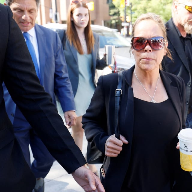 Freedom Convoy organizer Tamara Lich walks to the courthouse with her lawyer for a sentencing hearing in Ottawa on Wednesday.