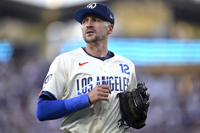 LOS ANGELES, CALIFORNIA - AUGUST 10: Nick Ahmed #12 of the Los Angeles Dodgers looks on against the Pittsburgh Pirates at Dodger Stadium on August 10, 2024 in Los Angeles, California.