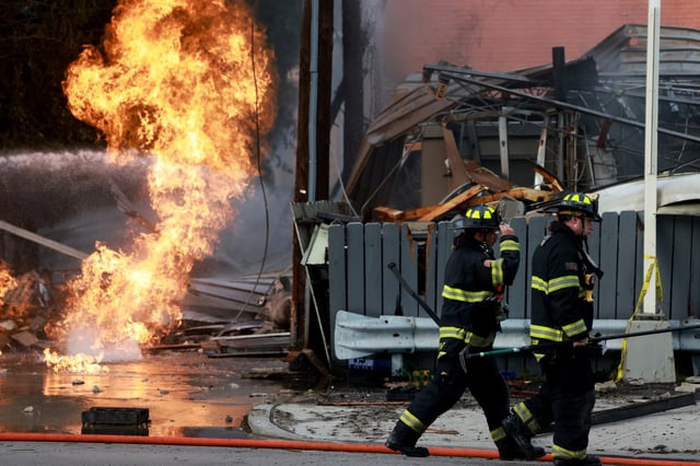 Firefighters battle a gas station fire and explosion at Ogden and Oak Park avenues in Berwyn on July 24, 2025. (Antonio Perez/Chicago Tribune)