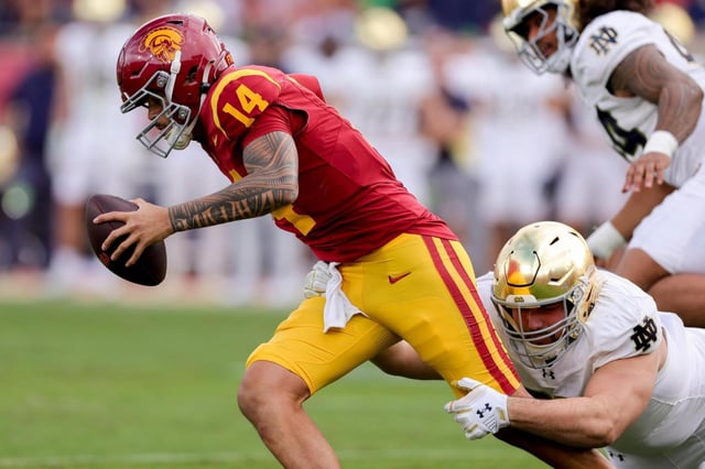 Notre Dame defensive lineman Gabriel Rubio sacks USC quarterback Jayden Maiava on Nov. 30, 2024, in Los Angeles. (Ryan Sun/AP)