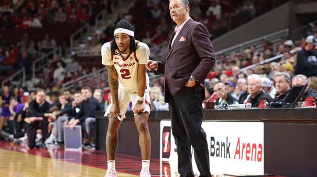 Arkansas Razorbacks guard Boogie Fland (2) and head coach John Calipari.  © Nelson Chenault-Imagn Images