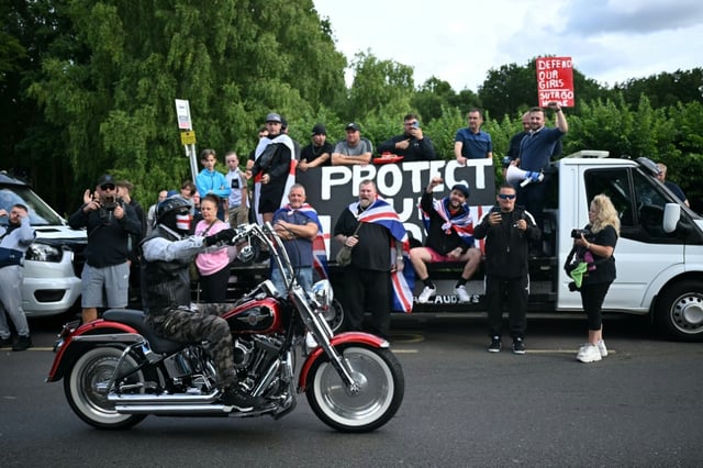 Anti-immigration protesters are seen outside The Bell Hotel, believed to be housing asylum seekers, in Epping, northeast of London on July 20, 2025