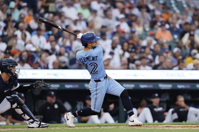 Jul 24, 2025; Detroit, Michigan, USA; Toronto Blue Jays third baseman Ernie Clement (22) hits a three-run homerun in the sixth inning against the Detroit Tigers  at Comerica Park. Mandatory Credit: Rick Osentoski-Imagn Images